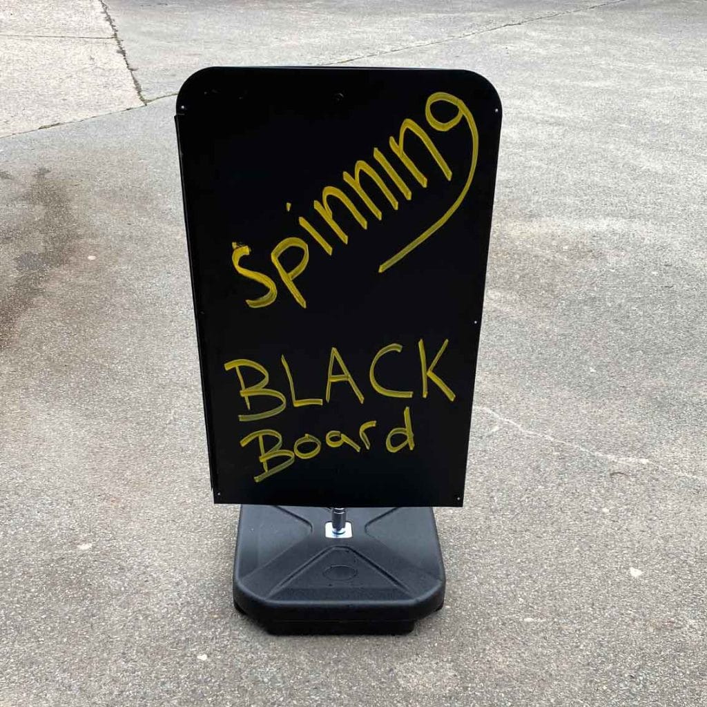spinning black board sign